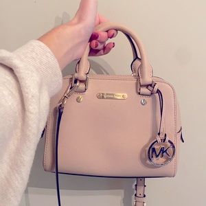 Micheal Kors blush pink crossbody small purse.